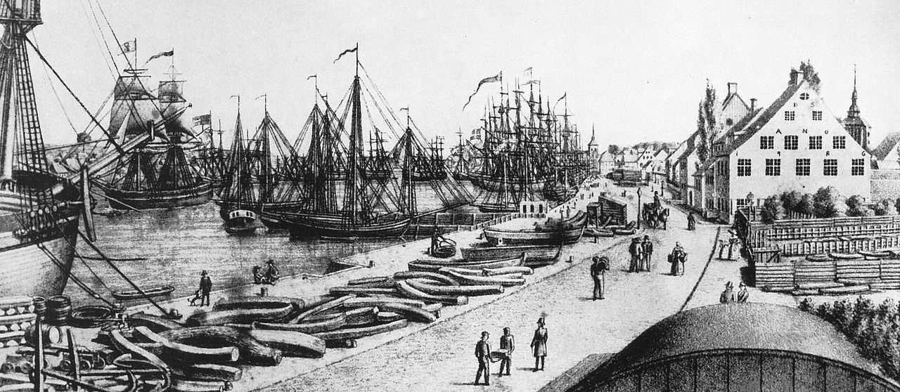 Historic Flensburg harbour with merchant houses and sailing ships